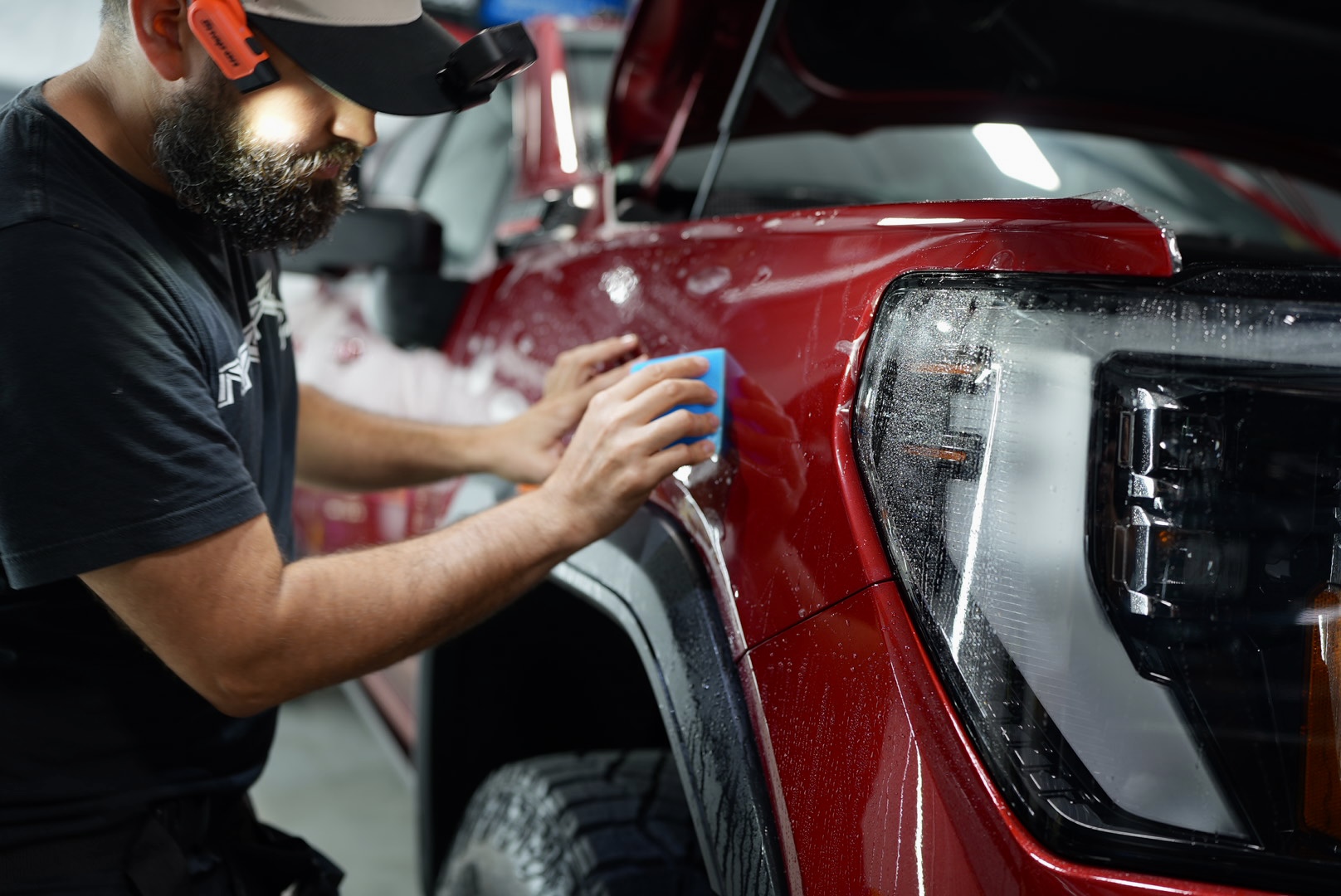 Clear paint protection film applied to a vehicle's front end